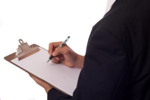 Professional pest control technician providing a free service estimate in Omaha.